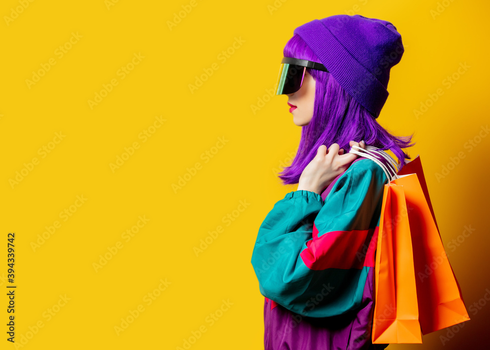 Style woman in VR glasses and 80s tracksuit with sopping bags