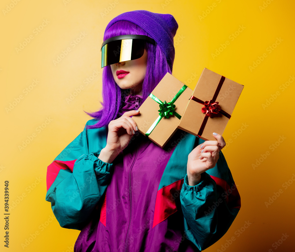 Style woman in VR glasses and 80s tracksuit with gift box