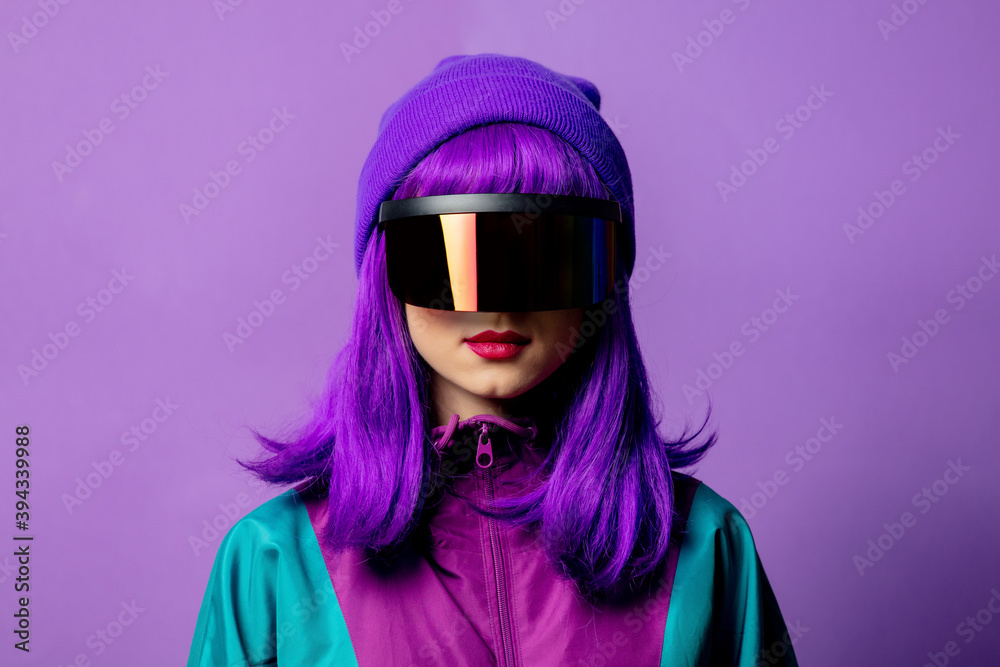 Style woman in VR glasses and 80s tracksuit on violet background Style woman in VR glasses and 80s tracksuit on violet background
