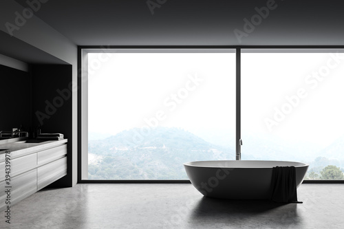 Gray and wooden bathroom with tub and sink © ImageFlow