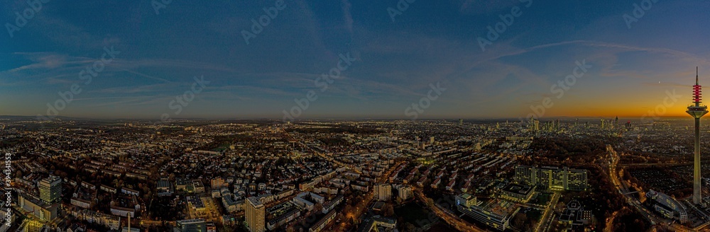 Drone image of the Frankfurt skyline with television tower in the evening during a colorful and impressive sunset