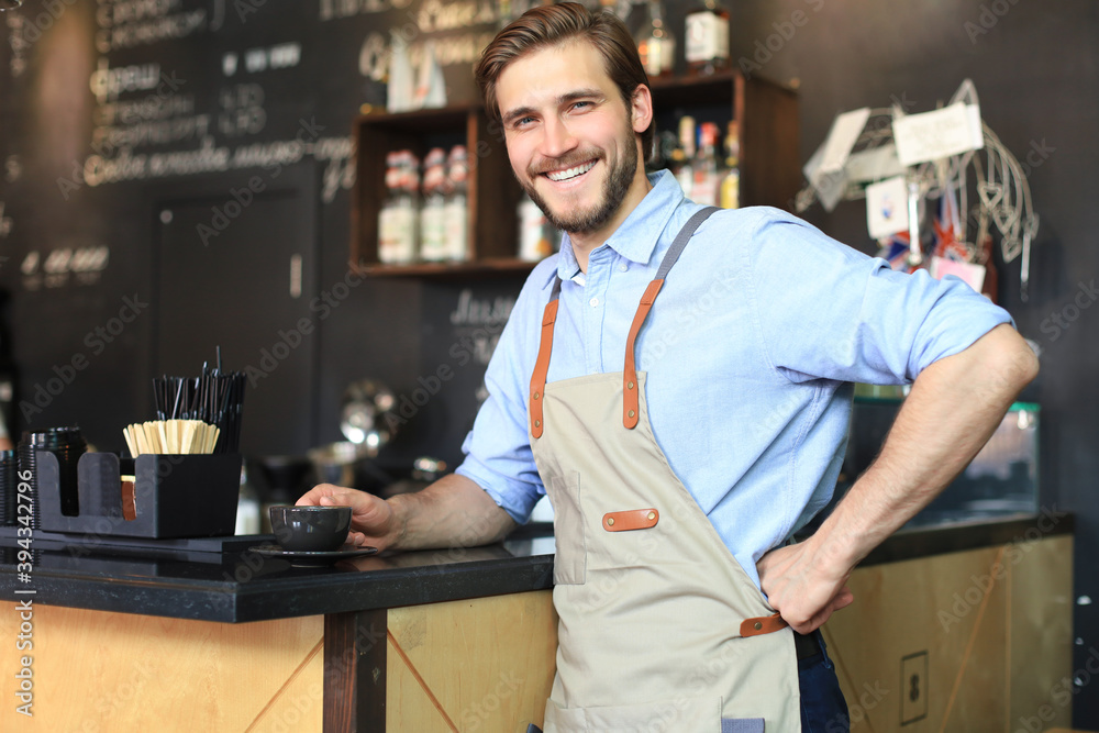 Fototapeta premium Small business owner working at his cafe.