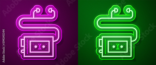 Glowing neon line Museum audio guide icon isolated on purple and green background. Headphones for excursions. Vector.