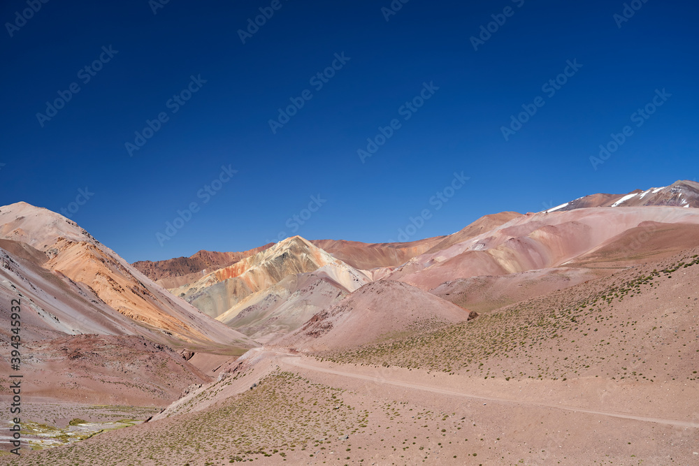 dry and arid desolation in the high andes mountains at the Agua Negra pass, with colorful mountains and rocks. desert landscape in high altitude in Argentina, South America