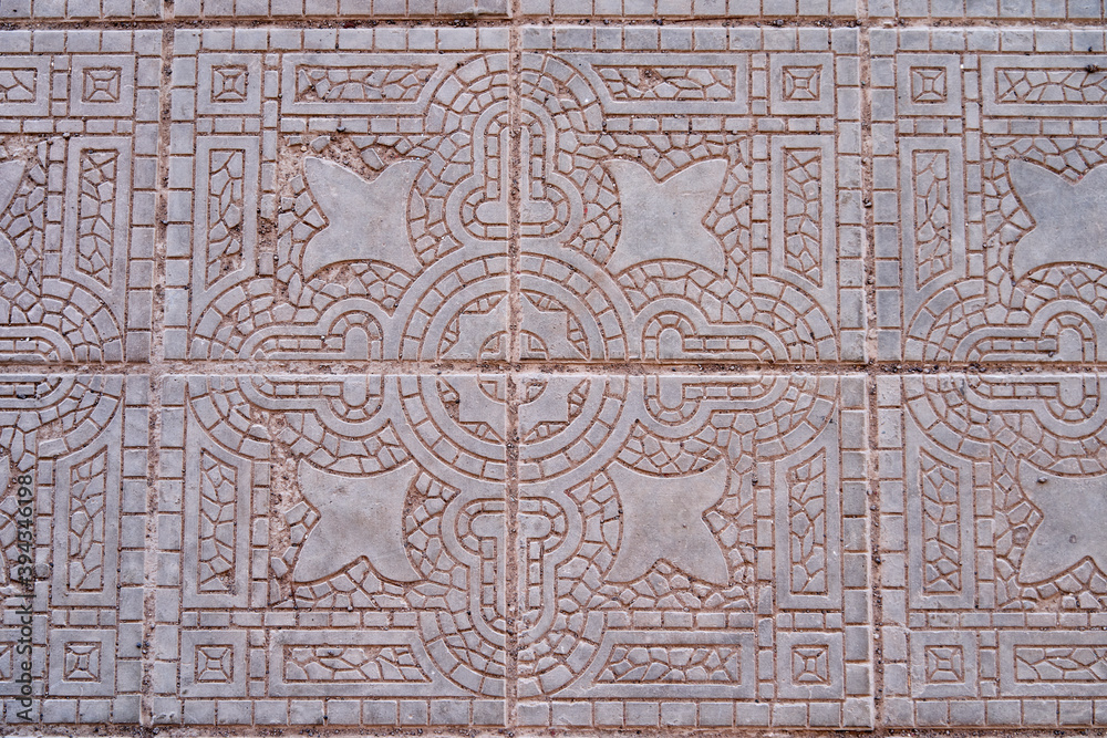 Details of white antique tiles with fine lines of decoration in mediterranean style like in Italy or Spain