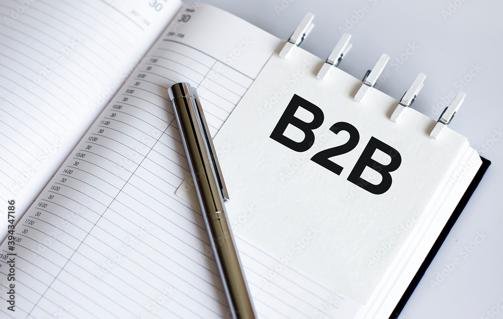 text B2B on the short note texture background with pen text B2B on the short note texture background with pen