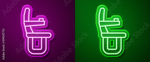 Glowing neon line Airplane seat icon isolated on purple and green background. Vector.