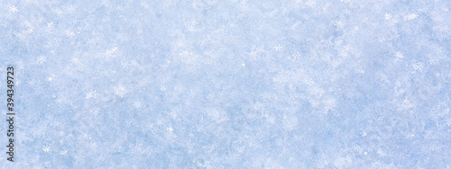 new year and christmas abstract snowy background with real snowflakes. macro shot. winter holiday banner