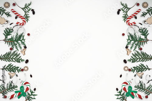 Thuja branches, spruce and New Year's decor. Copy space, flat lay, mock up, top view.