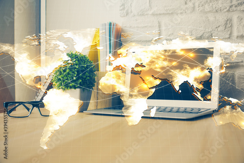 Multi exposure of business theme icons and work space with computer background. Concept of success.