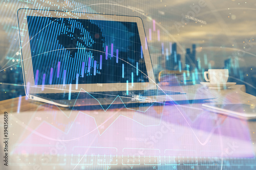 Wallpaper Mural Stock market chart hologram drawn on personal computer background. Multi exposure. Concept of investment. Torontodigital.ca