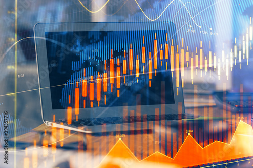 Stock market graph and table with computer background. Multi exposure. Concept of financial analysis. © peshkova