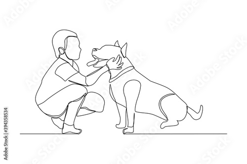 Continuous line drawing of happy little boy playing with dog pet. One line art concept of happy childhood. Vector illustration	