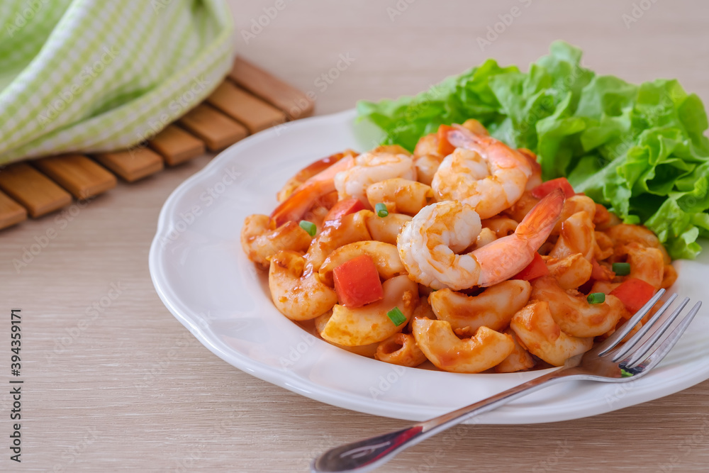 Stir fried macaroni with shrimp and vegetable on plate. Stir fried macaroni with shrimp and vegetable on plate.