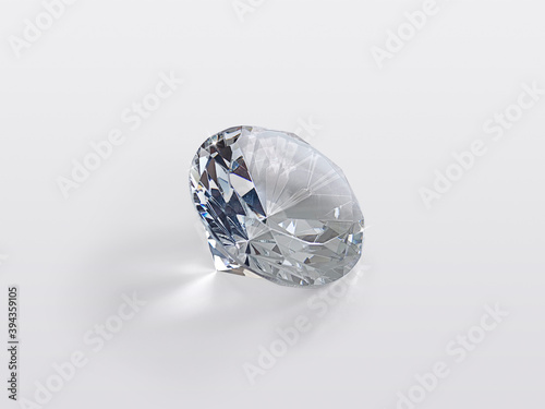 Round cut diamond on white glossy background