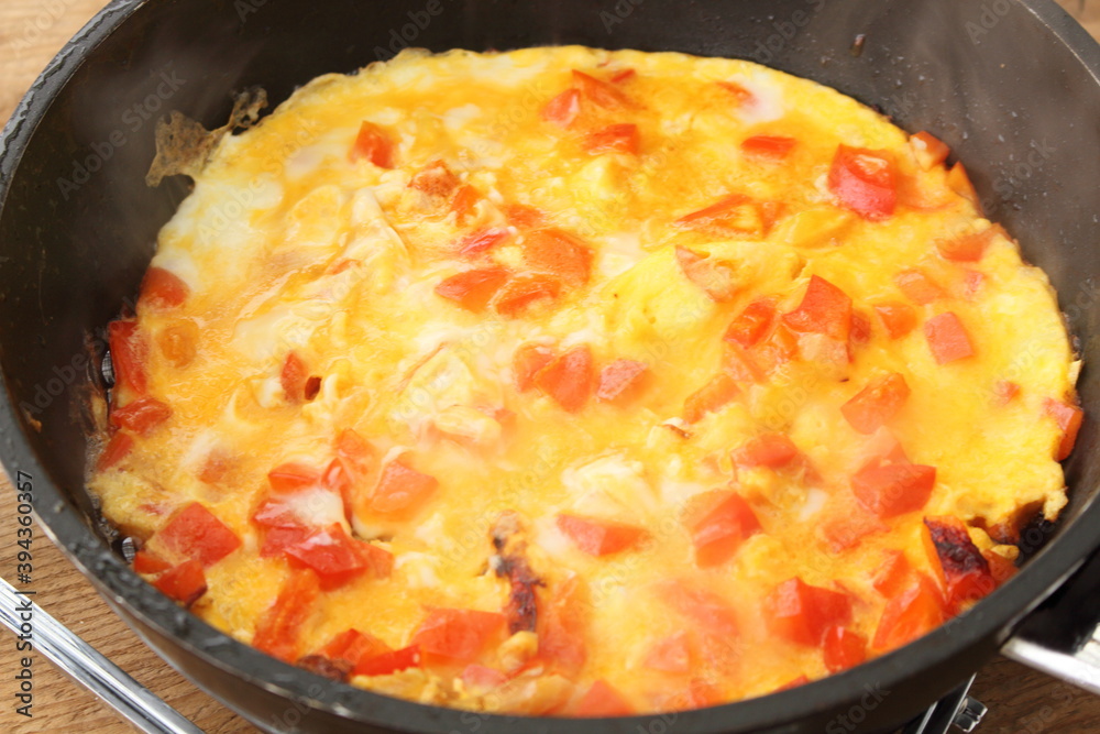 delicious omelette with paprika in a pan delicious omelette with paprika in a pan
