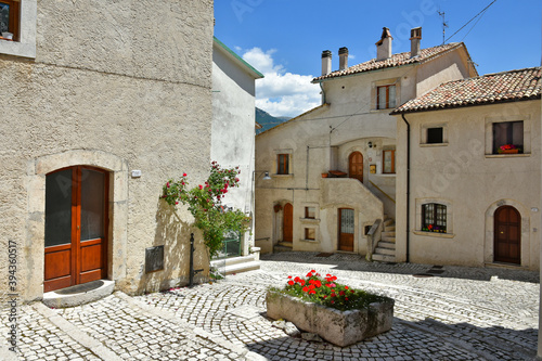 A narrow street among the old houses of Civitella Alfedena, a medieval village in the Abruzzo region, Italy. photo