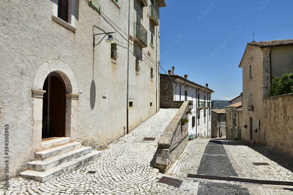 A narrow street among the old houses of Civitella Alfedena, a medieval village in the Abruzzo region, Italy.