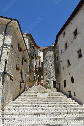 A narrow street among the old houses of Civitella Alfedena, a medieval village in the Abruzzo region, Italy.