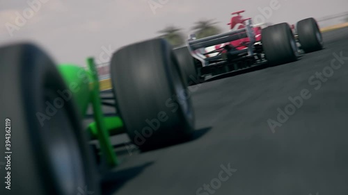 Dynamic rear view of a generic green formula one race car chasing the leader - realistic high quality 3d animation - my own car design - no copyright/trademark infringement
