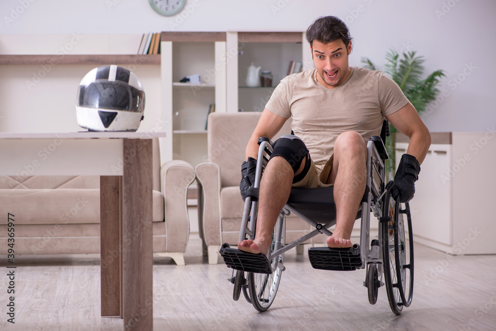 Young male motor-cyclist suffering at home after accident Young male motor-cyclist suffering at home after accident