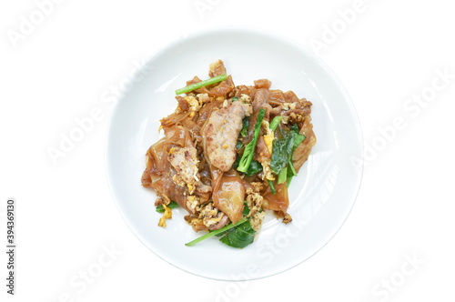 stir fried rice noodle with slice pork and Chinese kale in black sweet soy sauce on plate