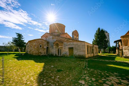 Old church in the countryside surrounded by fields photo