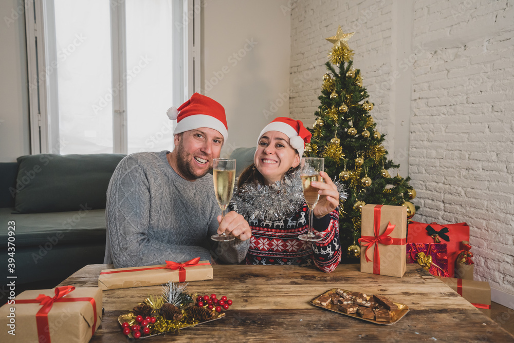 Portrait of happy couple celebrating christmas online cheering and showing presents. Webcam view Portrait of happy couple celebrating christmas online cheering and showing presents. Webcam view