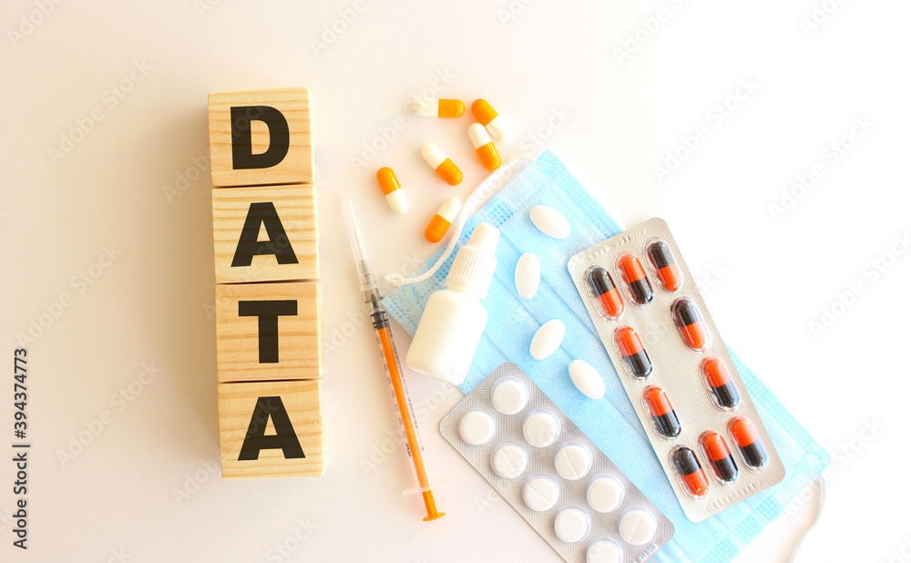 The word DATA is made of wooden cubes on a white background. Medical concept. The word DATA is made of wooden cubes on a white background. Medical concept.