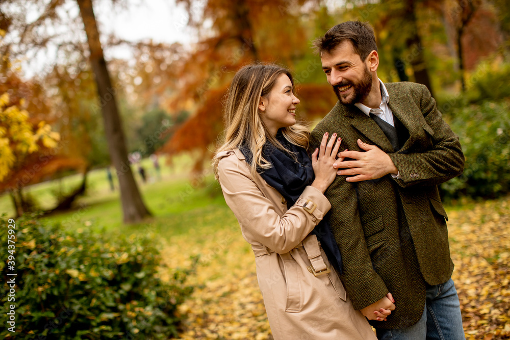 Young couple walking in the autumn park Young couple walking in the autumn park