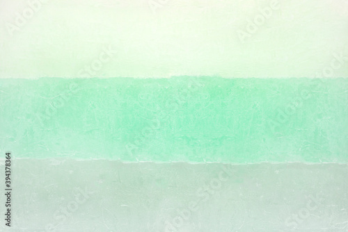 Background made of paraffin candle in three turquoise colors.