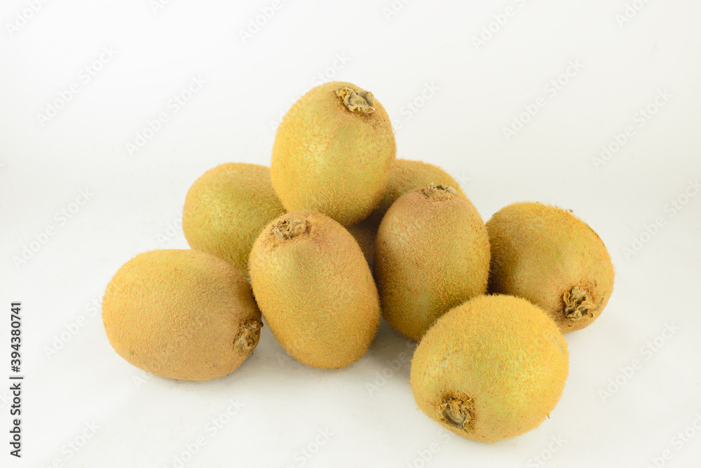 A pile of kiwifruits on white background.
A pile of kiwifruits on white background.
