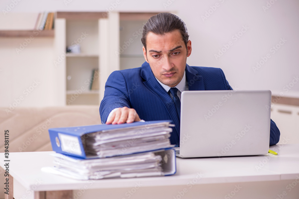 Young male employee working from home in pandemic concept Young male employee working from home in pandemic concept