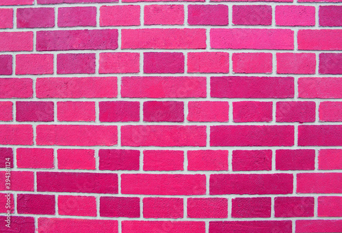 Abstract pink brick wall texture depicting in paint colors on an old brick wall. pink brick wall background pattern. Painted brick wall in pink empty space for your design © Natalia Bo