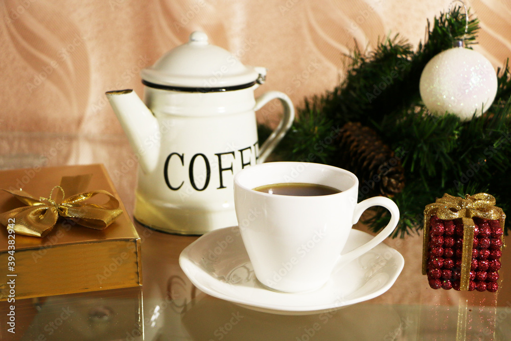 A cup of coffee on the table against the background of New Year's decor. Cup of coffee with Christmas decor on the table. A cup of coffee on the table against the background of New Year's decor. Cup of coffee with Christmas decor on the table.