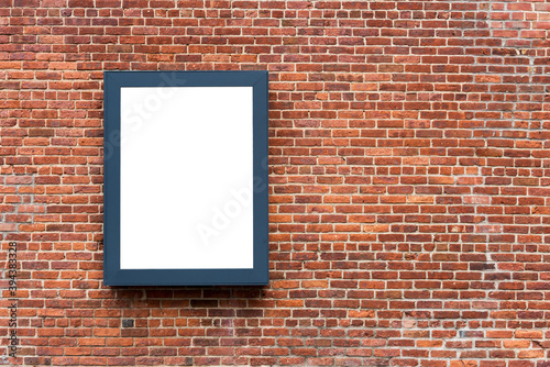 Blank advertising poster board on wall