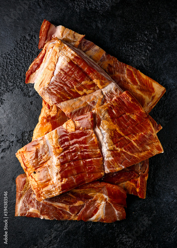 Fotografie Stripy cured pork side bacon pancetta smoked on wood chip