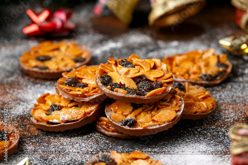 Vászonkép Christmas Chocolate Florentines cookies with almond and raisins with decoration,