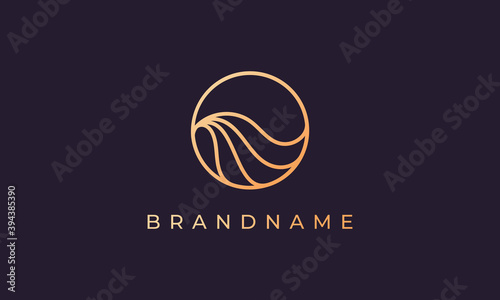 circle with line forming ocean wave and with gold color