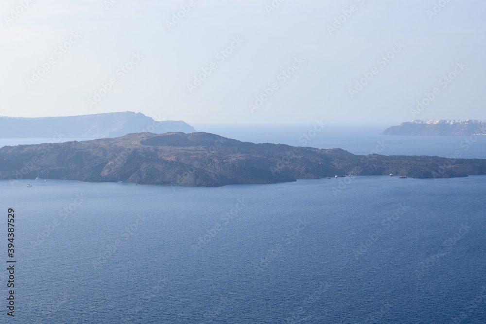 Nea Kameni, a Greek small and uninhabited island located in the Gulf of Santorini. Greece Nea Kameni, a Greek small and uninhabited island located in the Gulf of Santorini. Greece