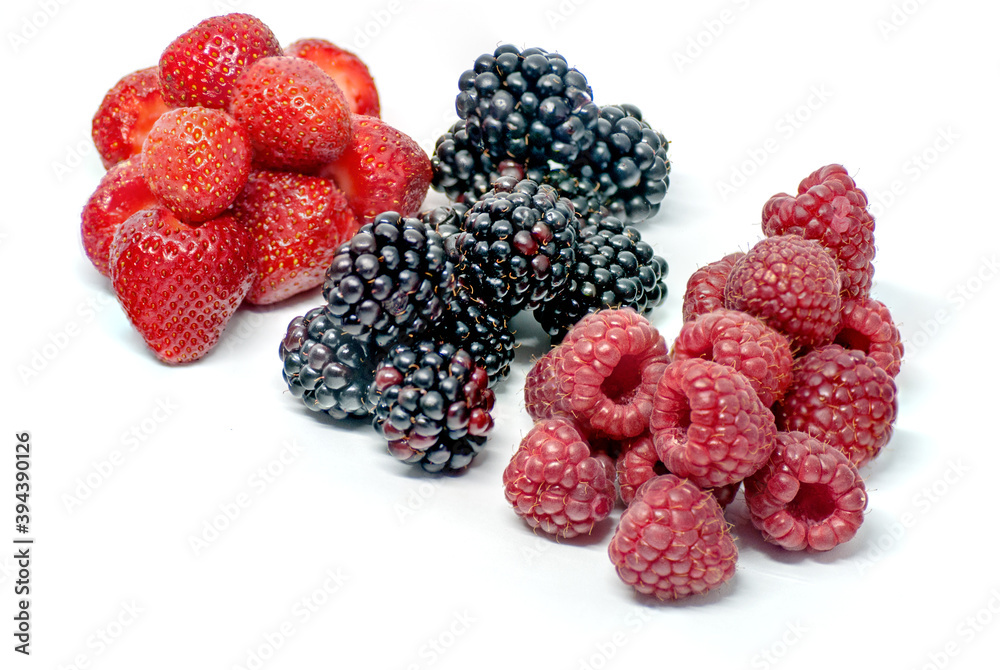 assorted piles of forest fruits on white assorted piles of forest fruits on white