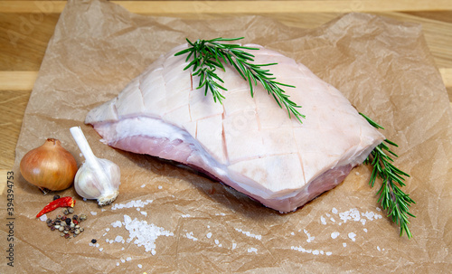 Canvas Print Raw Pork belly with sea salt, onion, garlic and herbs, rosemary