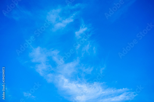 Abstract of White clouds on blue sky texture background with copy space for banner © Fai