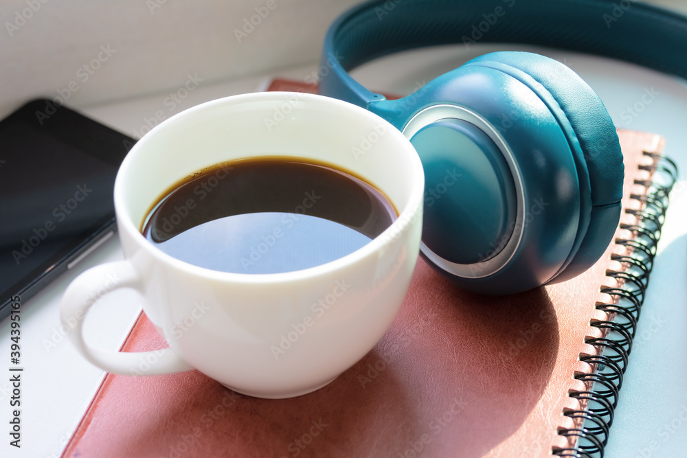 Black coffee and headphone music relaxing in room. Black coffee and headphone music relaxing in room.