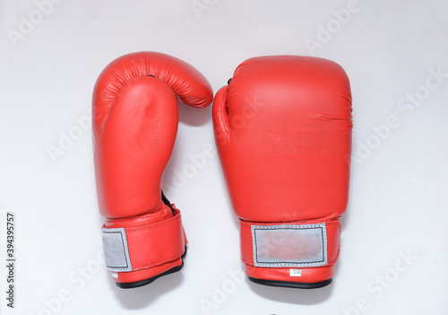 Red gloves  for boxing, mma - sportive  outfit   on white backgrounds . gloves © Marat Lala