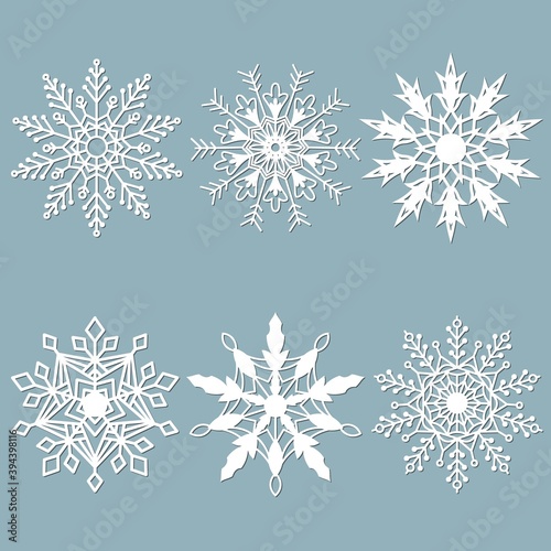 Set of snowflakes. Laser cut pattern for christmas paper cards  design elements  scrapbooking. Vector illustration.