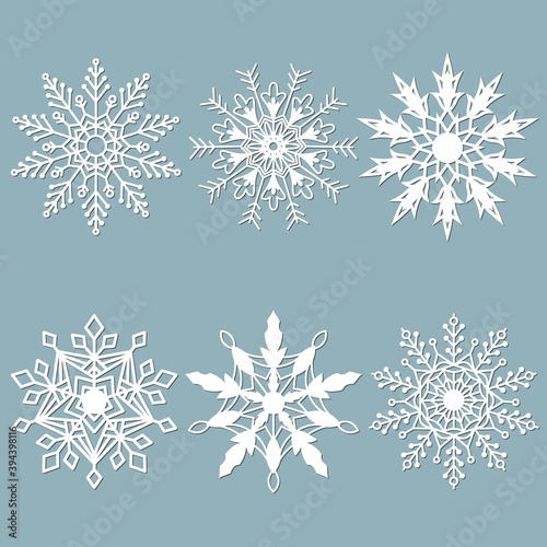 Set of snowflakes. Laser cut pattern for christmas paper cards, design elements, scrapbooking. Vector illustration.