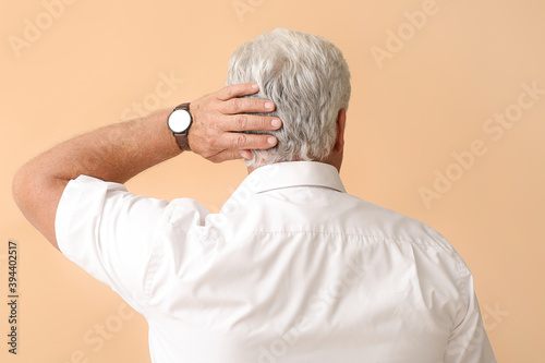 Stylish senior man with gre...