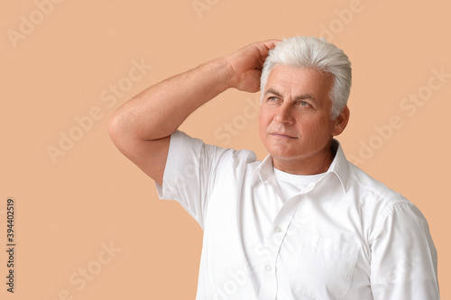 Stylish senior man on color...