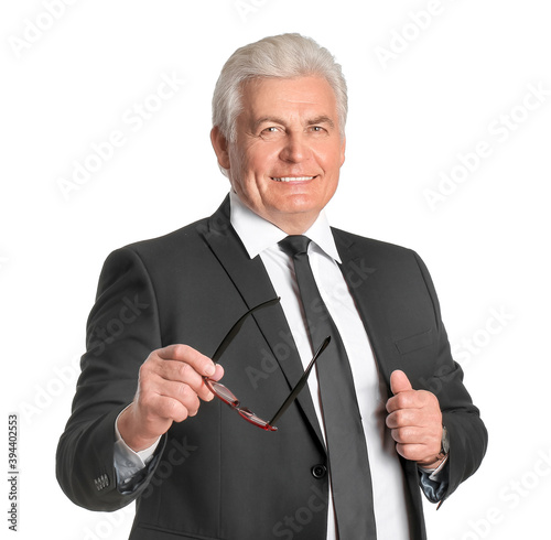 Stylish senior man on white...